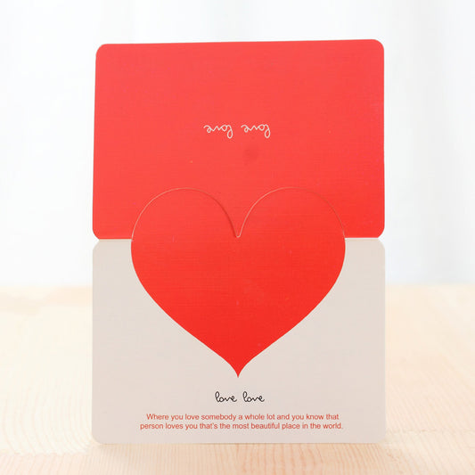 Red and beige card with heart design on a white background