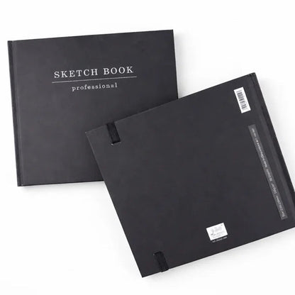 Two black sketch books on a white background
