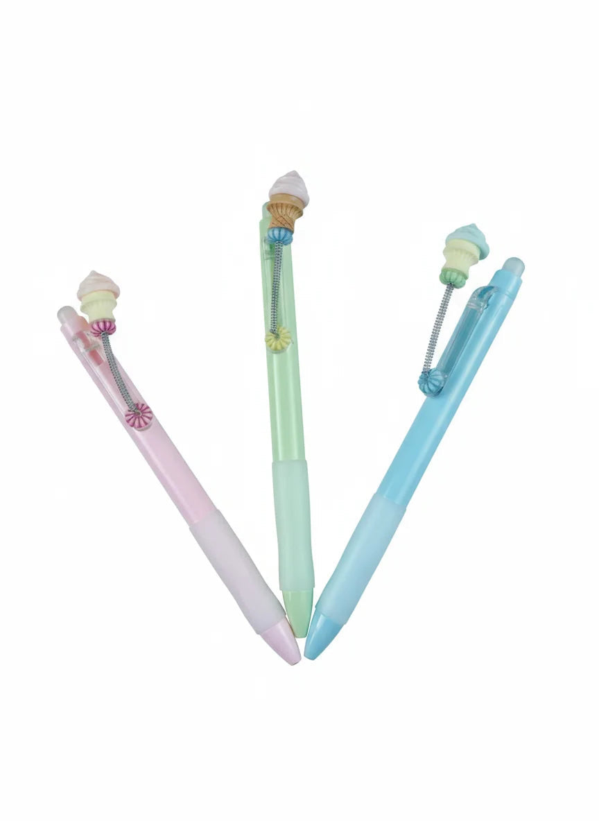 Three pastel-colored pens (pink, green, blue) on a white background