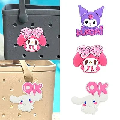 Cartoon character stickers on a gray basket and beige suitcase with a blue background.