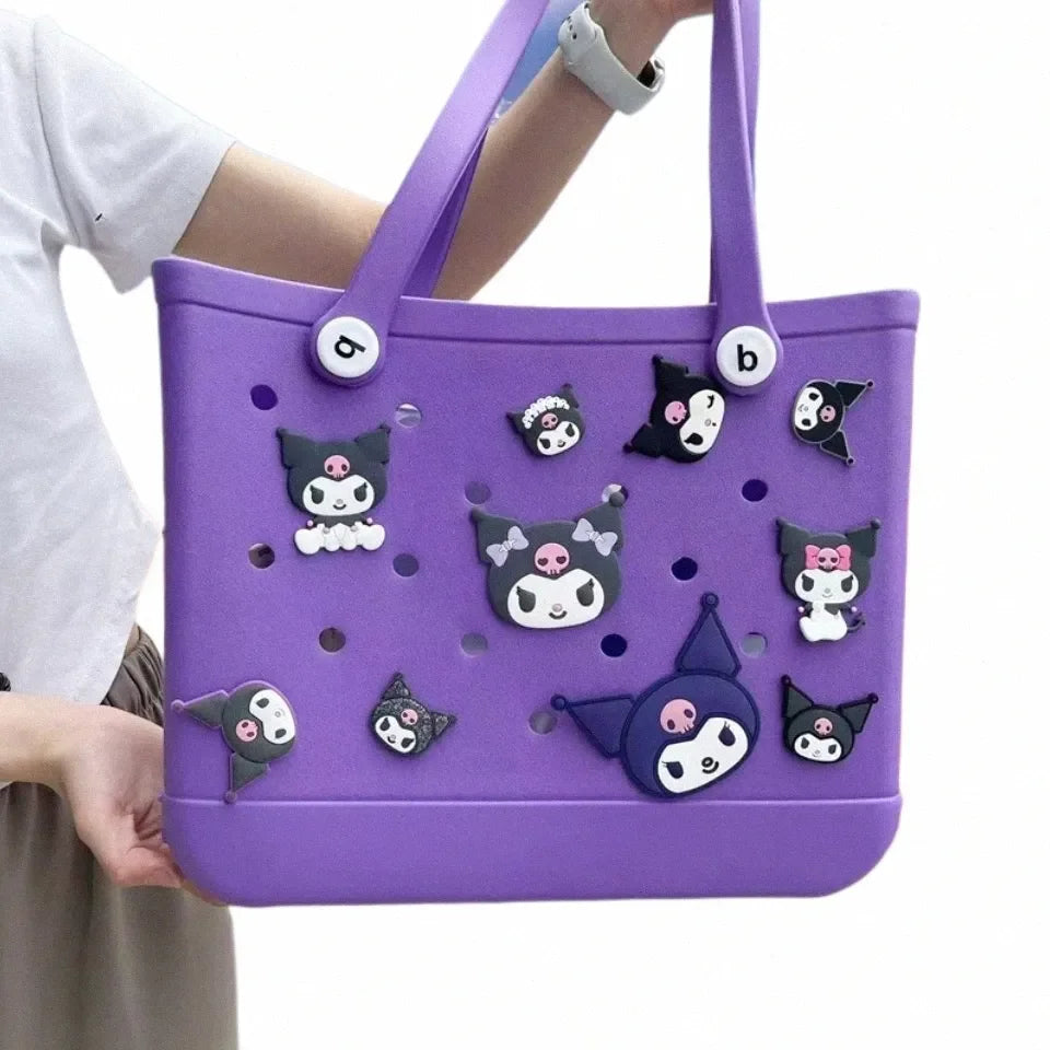 Purple tote bag with cartoon character decorations held by a person
