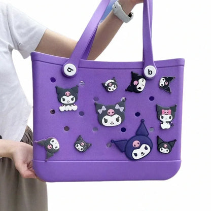 Purple tote bag with cartoon character decorations held by a person