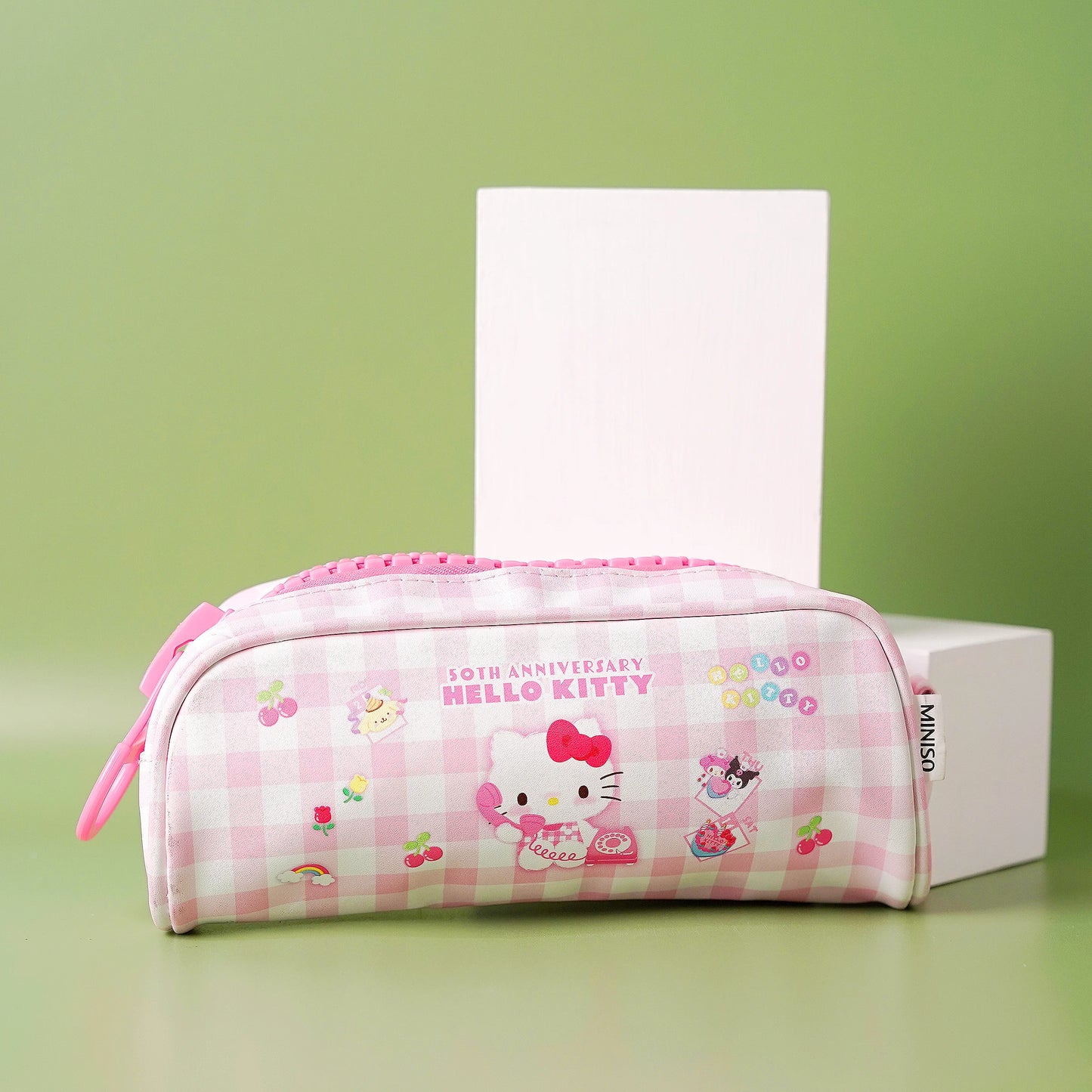 A collection of large zipper pencil cases with character patterns in pink and purple colors.
