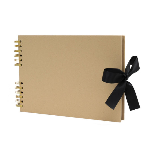 Beige notebook with a black ribbon on a white background