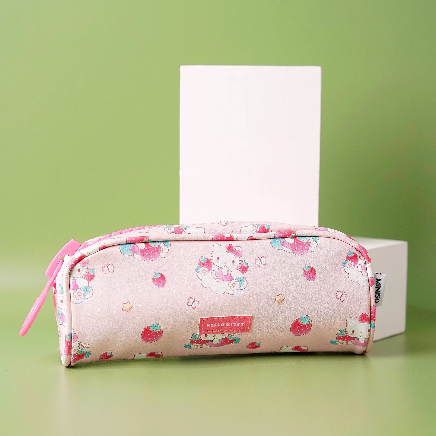 A collection of large zipper pencil cases with character patterns in pink and purple colors.