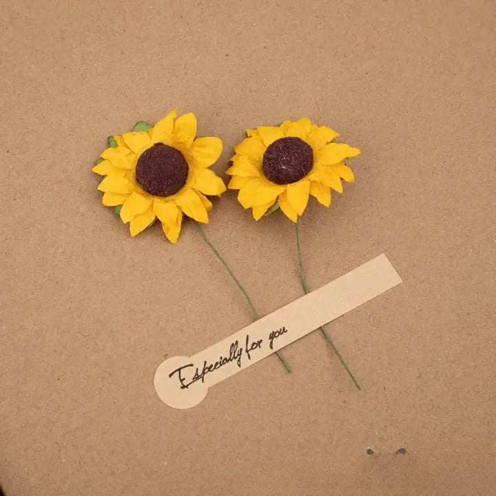 Two yellow sunflower earrings on a brown background with a 'Especially for you' tag.