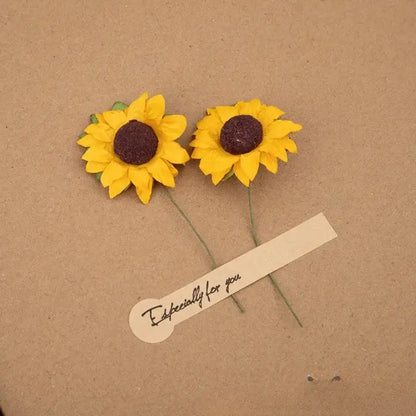 Two yellow sunflower earrings on a brown background with a 'Especially for you' tag.