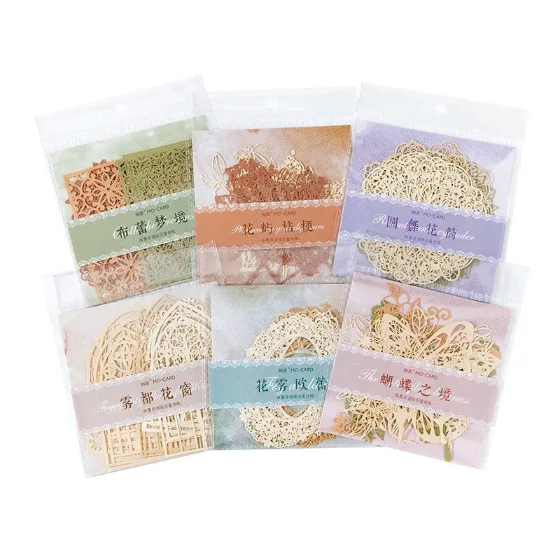 Set of decorative paper fans in clear packaging on a white background