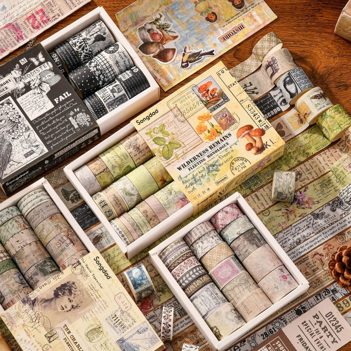 Collection of washi tape rolls in various designs and packaging on a wooden surface.