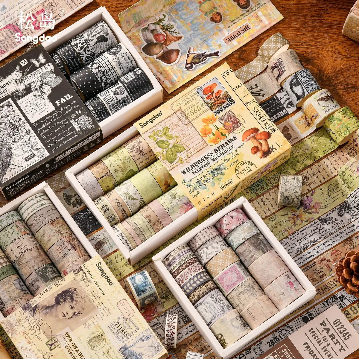 Collection of decorative washi tapes in various designs on a wooden surface.