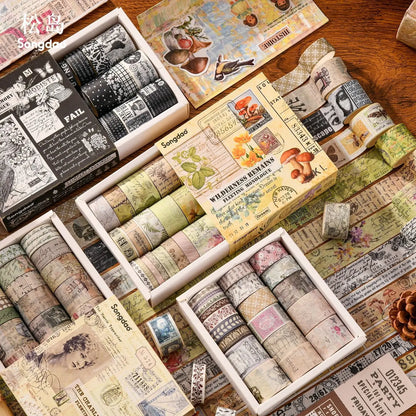 Collection of decorative washi tapes in various designs on a wooden surface.