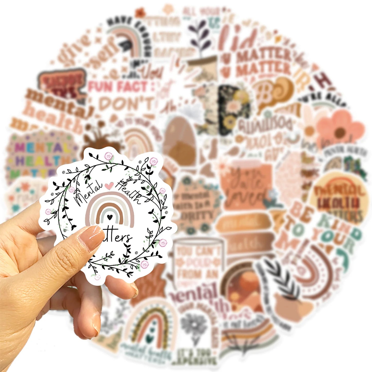 Hand holding a 'Mental Health Matters' sticker with a colorful assortment of health-themed stickers in the background.