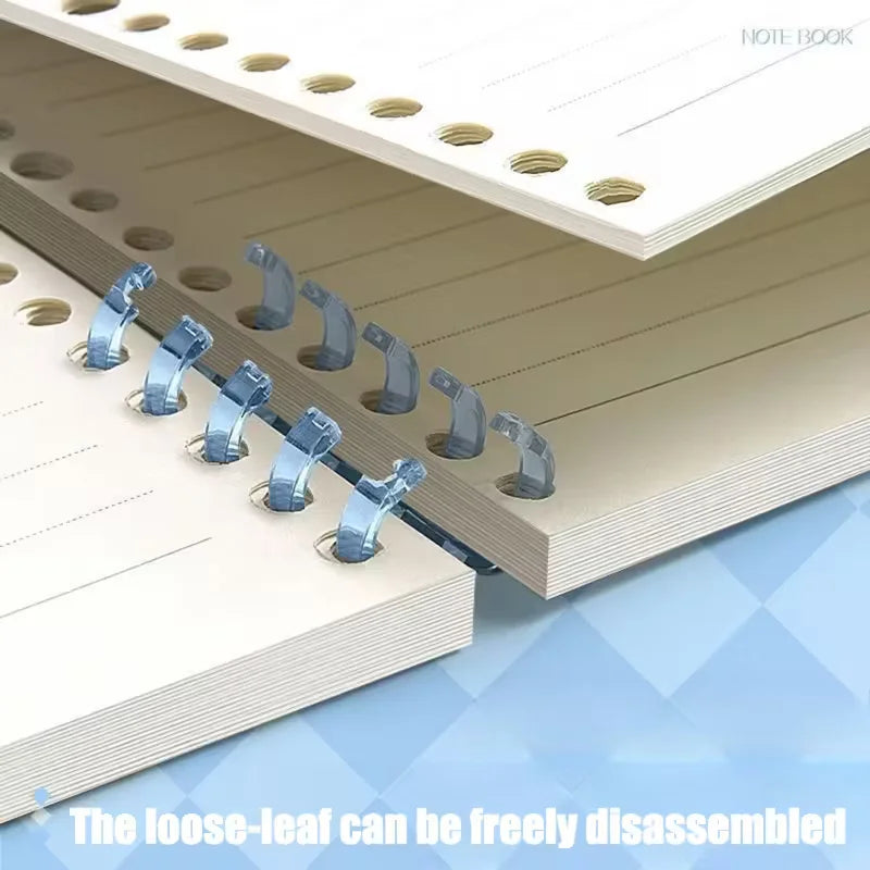 Loose-leaf notebook with metal binding clips on a white background