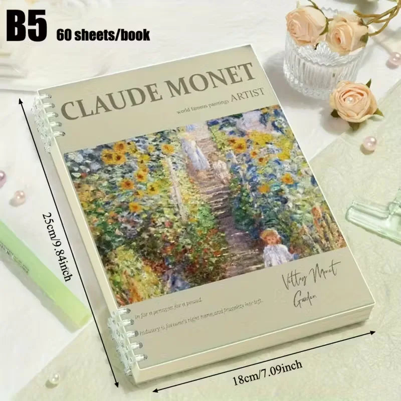 Notebook with Claude Monet design on a decorative surface with flowers