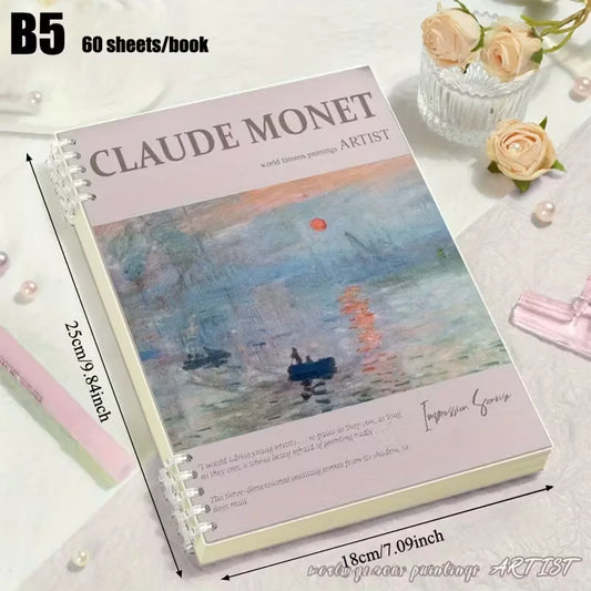 Notebook with Claude Monet design on a white surface with flowers