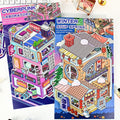 Two colorful cardboard models of urban landscapes with detailed facades and street elements.