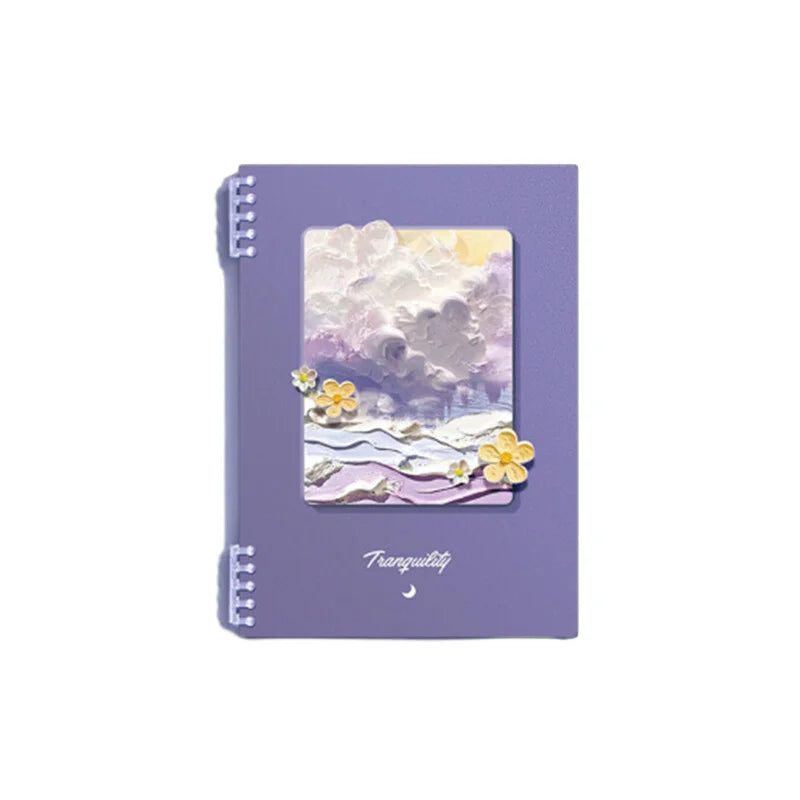 Purple notebook with a scenic cover design on a white background