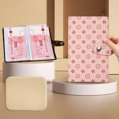 Pink notebook with star pattern held by a hand on a beige background