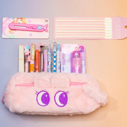 Plush pencil case with stationery items on a gradient background