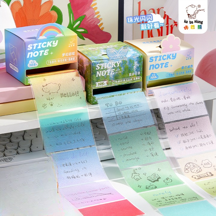 Colorful sticky notes with various designs and text on a desk.