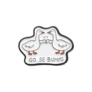 Enamel pin with two cartoon geese and 'GOOSE BUMPS' text on a white background