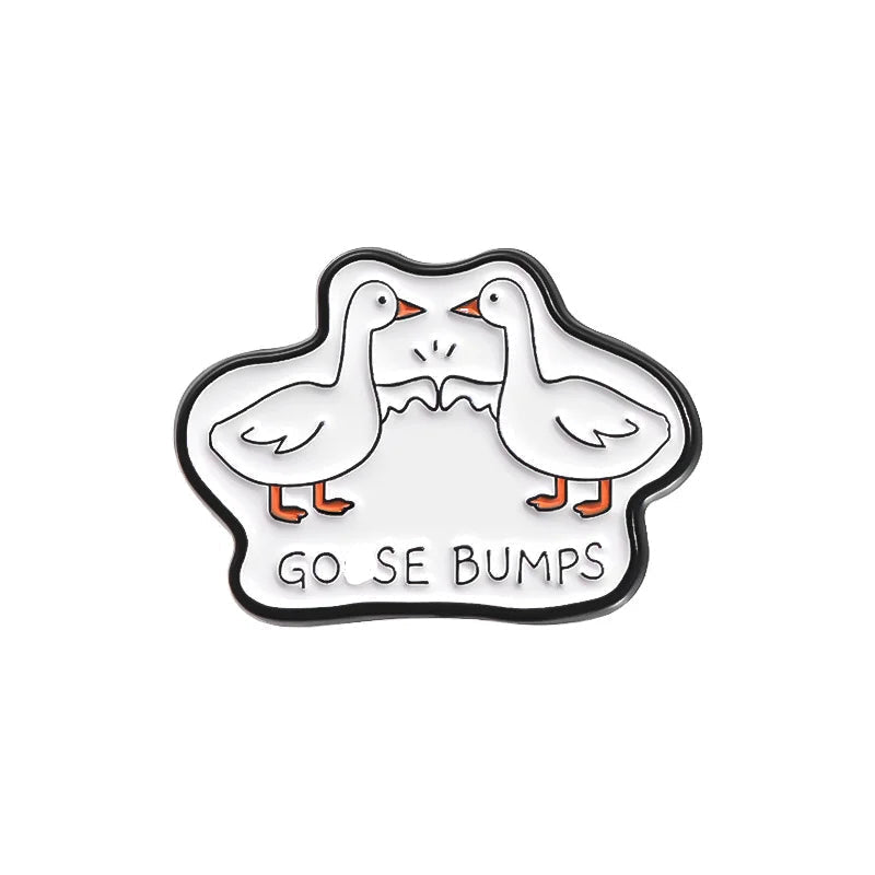 Enamel pin with two cartoon geese and 'GOOSE BUMPS' text on a white background
