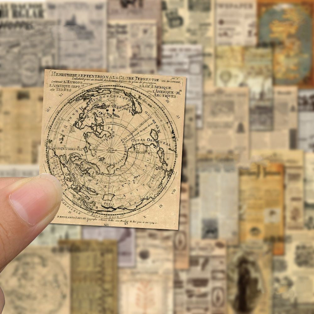 Vintage-style map held by a hand with a collage of similar maps in the background