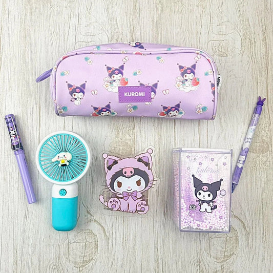 Kuromi-themed stationery items including a pencil case, fan, and notebook on a wooden surface.