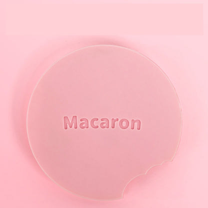 Pink silicone lid with 'Macaron' text on a pink background