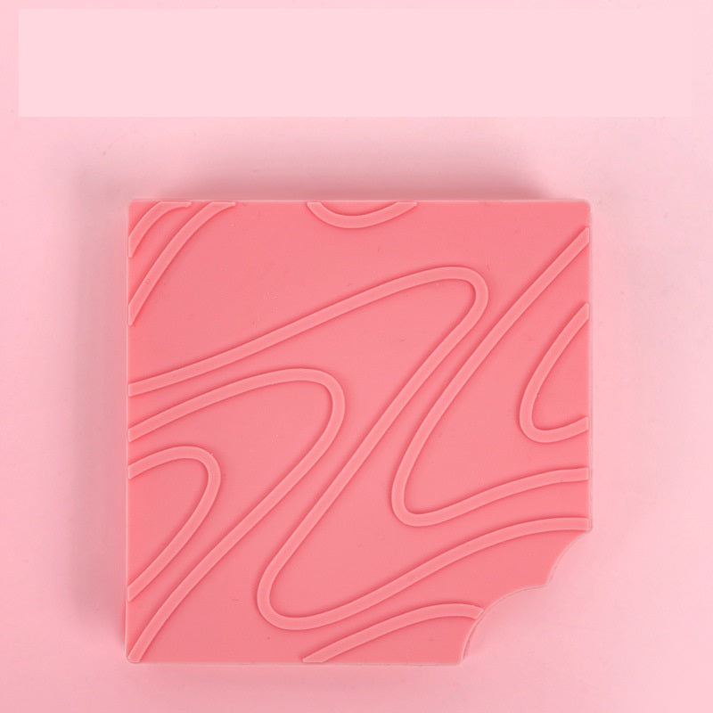 Pink textured square on a pink background