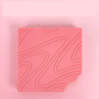 Pink textured square on a pink background