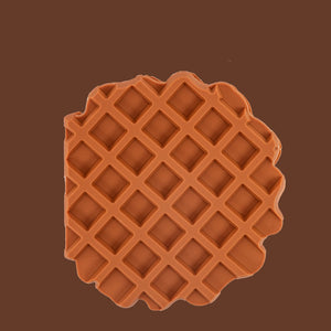 Brown waffle-patterned object on a brown background