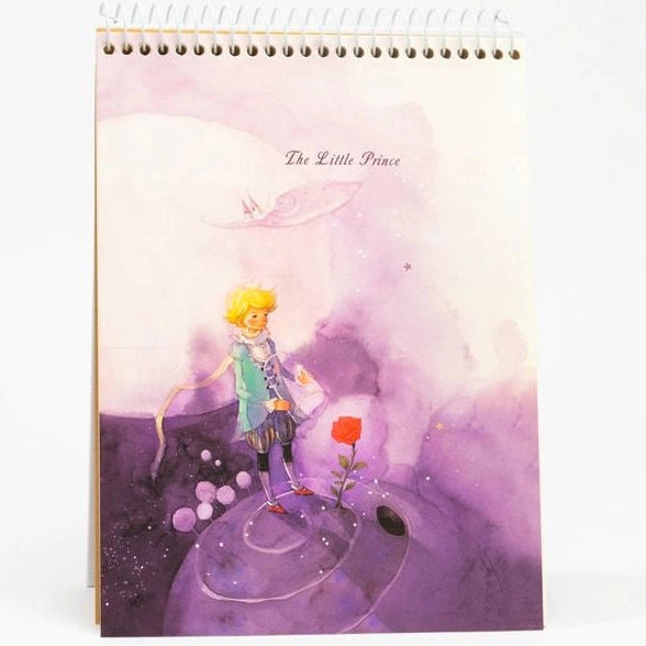 Notebook with 'The Little Prince' illustration on a white background