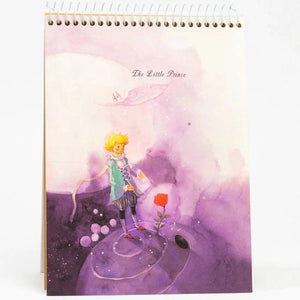 Notebook with 'The Little Prince' illustration on a white background
