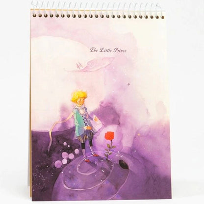 Notebook with 'The Little Prince' illustration on a white background