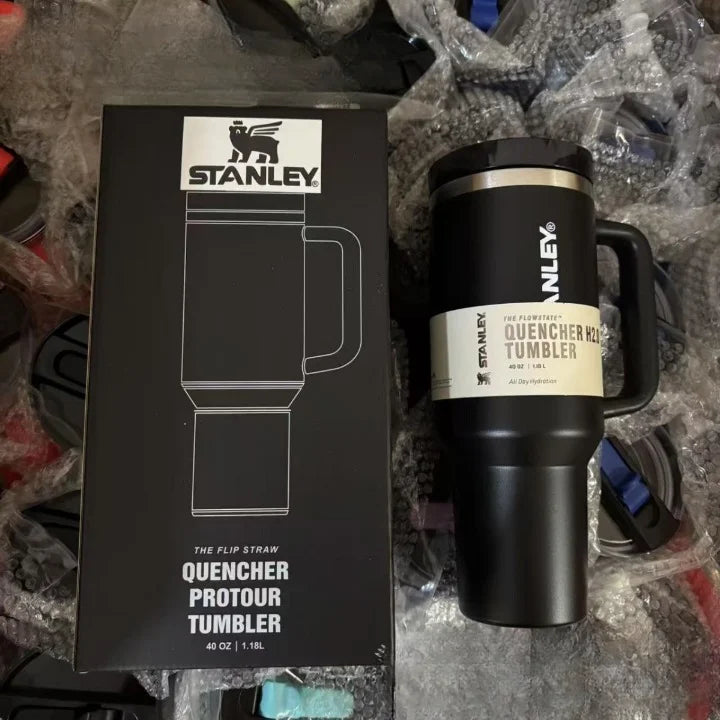 Stanley tumbler with packaging on a textured surface