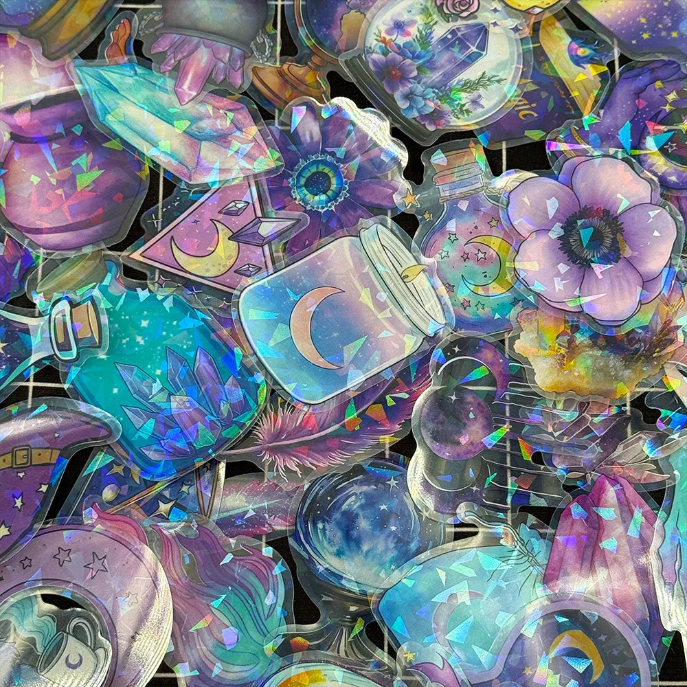 Collection of colorful, iridescent stickers with fantasy designs on a black background.