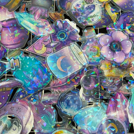 Collection of colorful, iridescent stickers with fantasy designs on a black background.