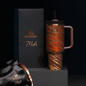Stanley mug with tiger stripe pattern and matching box on a black background