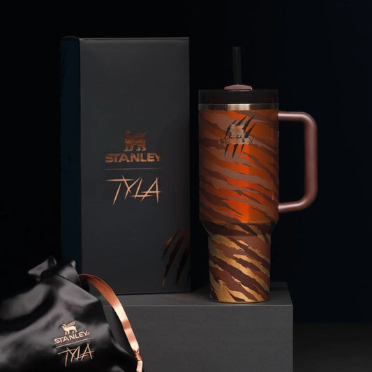 Stanley mug with tiger stripe pattern and matching box on a black background