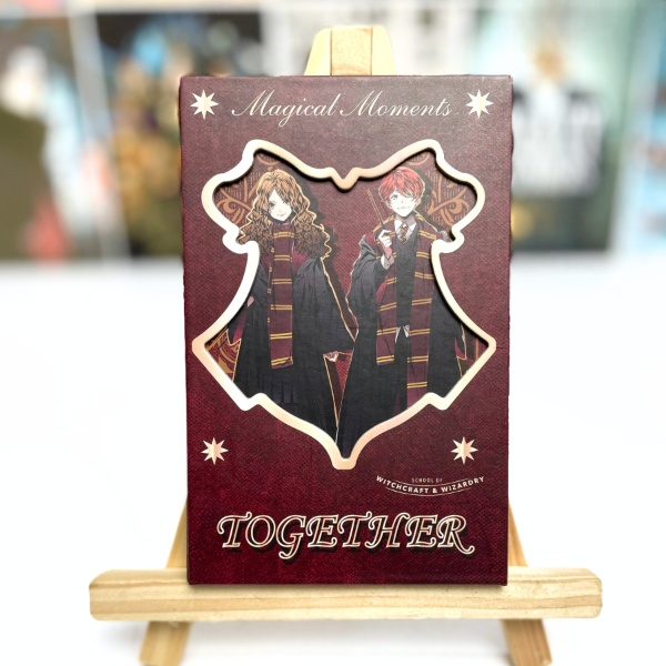 Card with characters and 'Together' text on a wooden stand