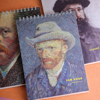 Three notebooks with Van Gogh self-portraits on an orange surface