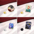 A collection of enamel pins with designs based on Van Gogh's artwork, displayed on a red fabric surface.