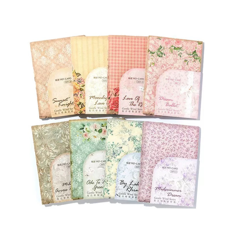 Set of floral and patterned cards with visible brand name on a white background