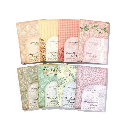 Set of floral and patterned cards with visible brand name on a white background