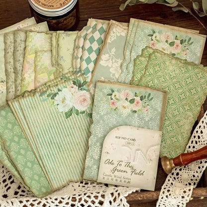 Collection of vintage-style greeting cards with floral and patterned designs on a lace doily.