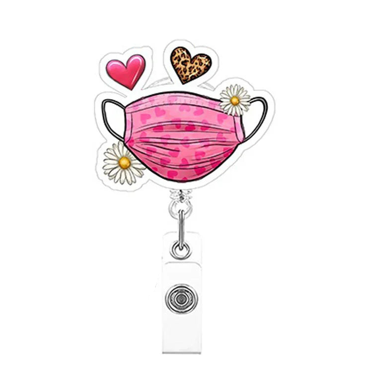 Mask holder with pink polka dot mask, heart, leopard print heart, and daisy designs on a white background.