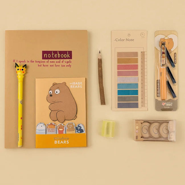 Notebook, pen, color swatch, and other stationery items on a beige background