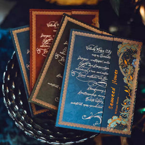 Decorative cards with intricate designs and text on a dark surface