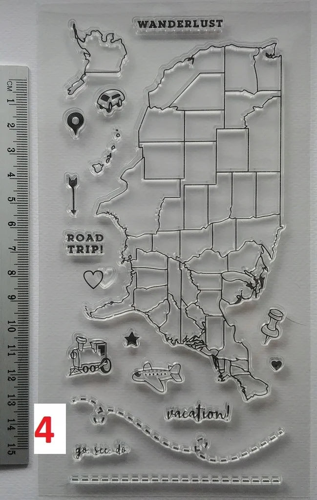 Clear stamp set with map design and travel-themed elements on a gray background.